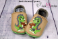 Preview: Lederpuschen Dino mit Keks
